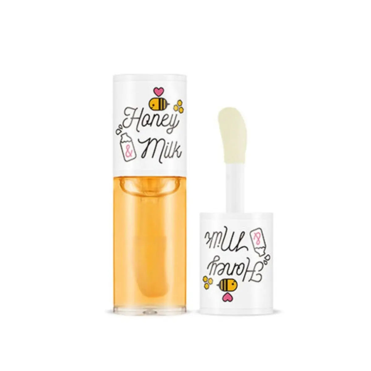 Huile à lèvres Honey & Milk dans un flacon transparent avec bouchon doré.